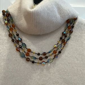 Three strand beaded chain necklace.